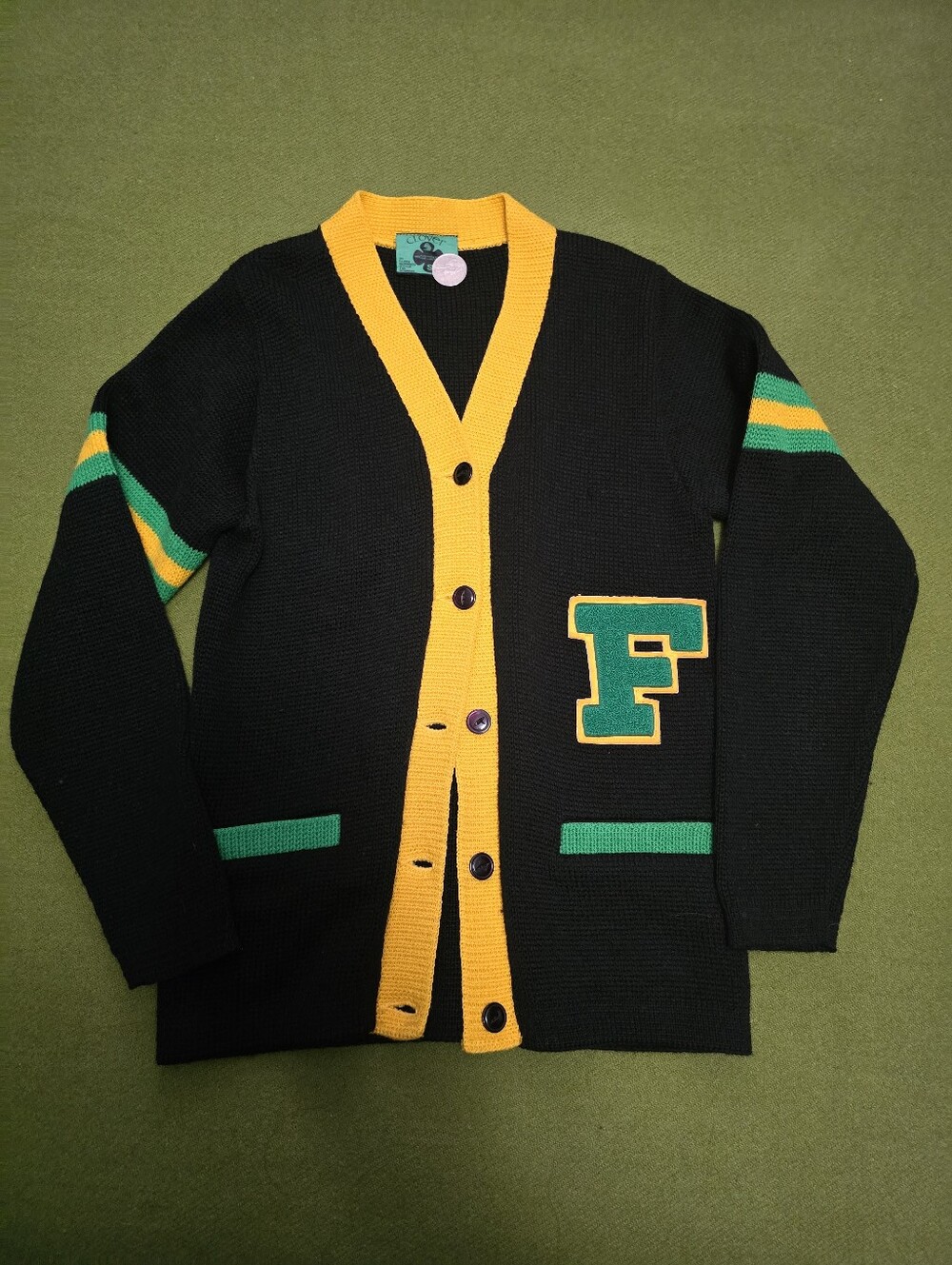 black and yellow 1950s-style varsity letterman cardigan sweater with a green "F"